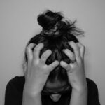 현대인의 숙제, 스트레스 다스리기…일상 속 ‘마음 근력’ 키우는 생활 습관 주목 a woman covering her face with her hands