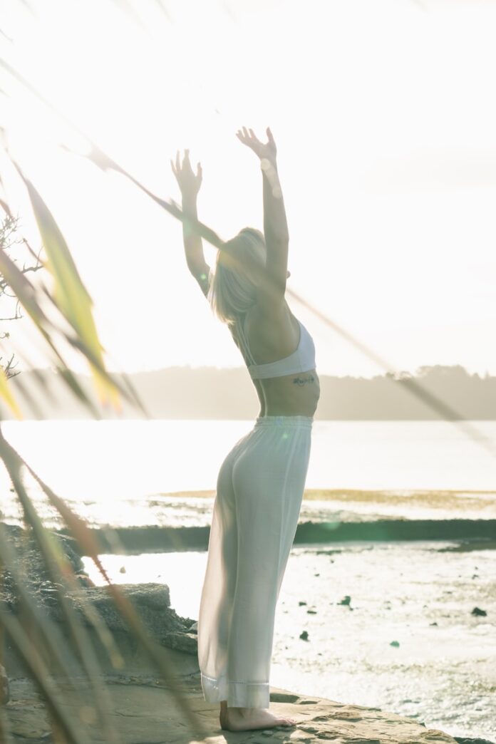 Photo by Dane Wetton woman standing near body of water