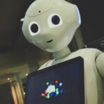 내 손안의 건강 비서, AI와 함께하는 스마트 라이프 white robot toy holding black tablet