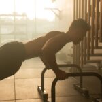“근육, 건강관리의 핵심으로 자리잡다…일상 속 근육 키우기 전략” a man is doing push ups on a machine